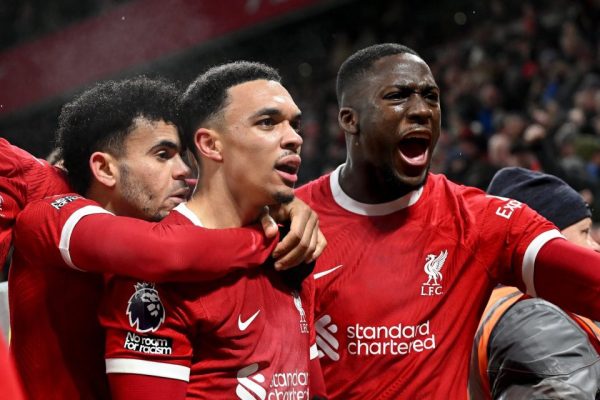 Liverpool hit late double to preserve Premier League home record