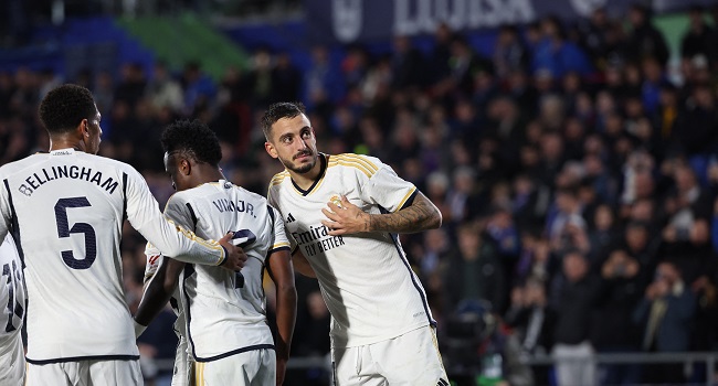 Joselu Double Sends Madrid Top At Getafe